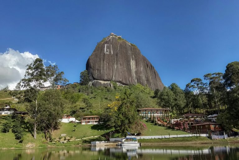 MEDELLÍN → GUATAPÉ ONE-DAY PRIVATE TOUR · TOUR PRIVADO Guatapé, just for you. Guatapé, solo para ti. Piedra del Peñol · the painted pueblito · the lake — one perfect private day.